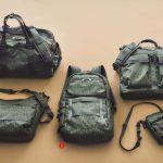 CIE レインカモシリーズ ① ダッフルバッグ　￥35,750　② ショルダーバッグ　￥17,600　③ バックパック　￥30,800　④ ボトルミニショルダーバッグ　￥11,000　⑤ ヘルメットバッグ　￥33,000