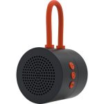 コンパクトな黒と赤のBluetoothスピーカーの画像.